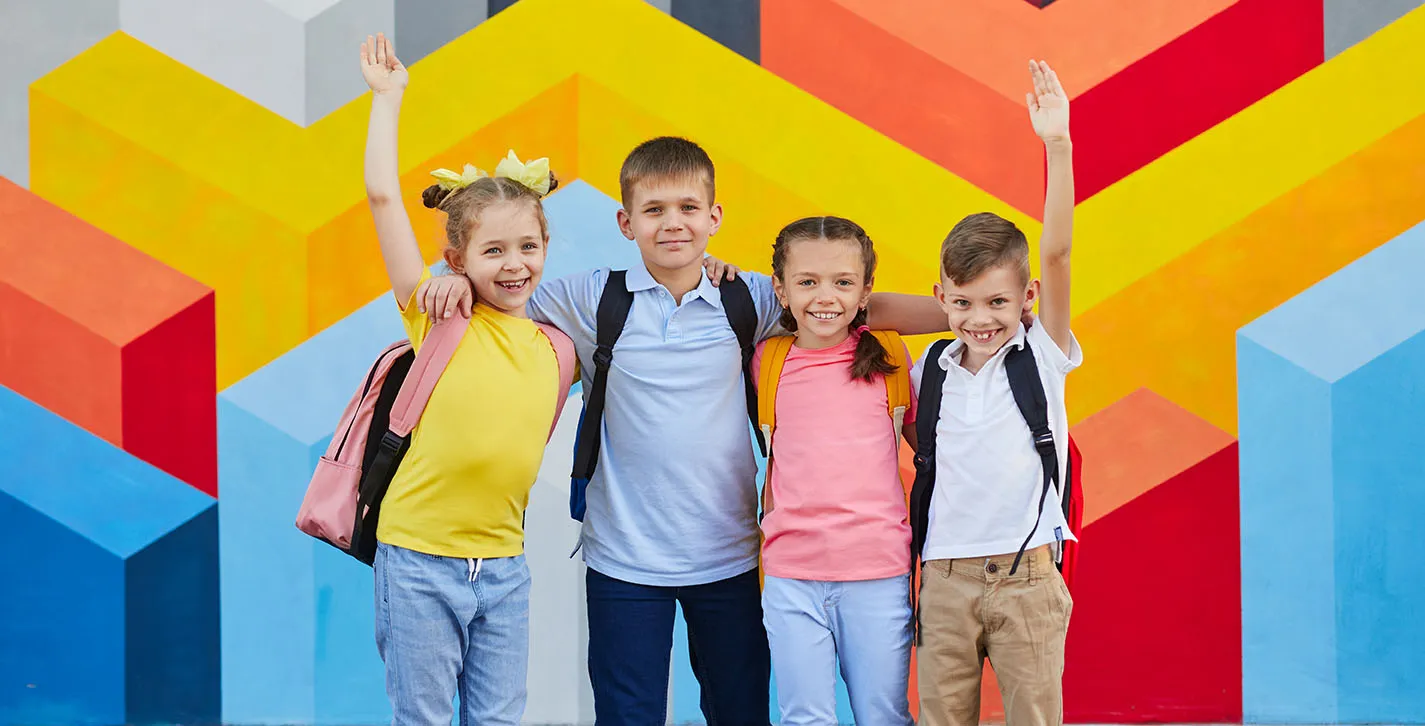 group-schoolchildren-against-colorful-wall2