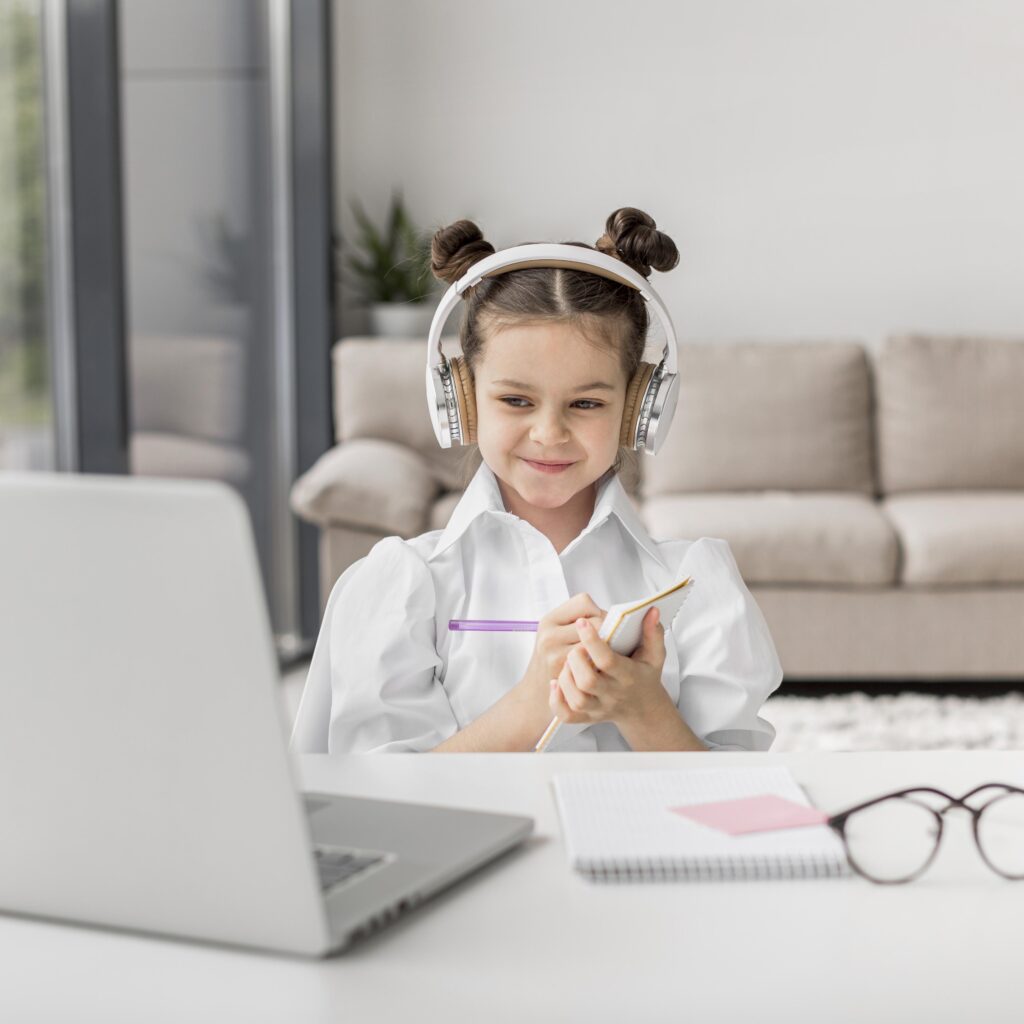 little-girl-listening-her-teacher-through-headphones-indoors